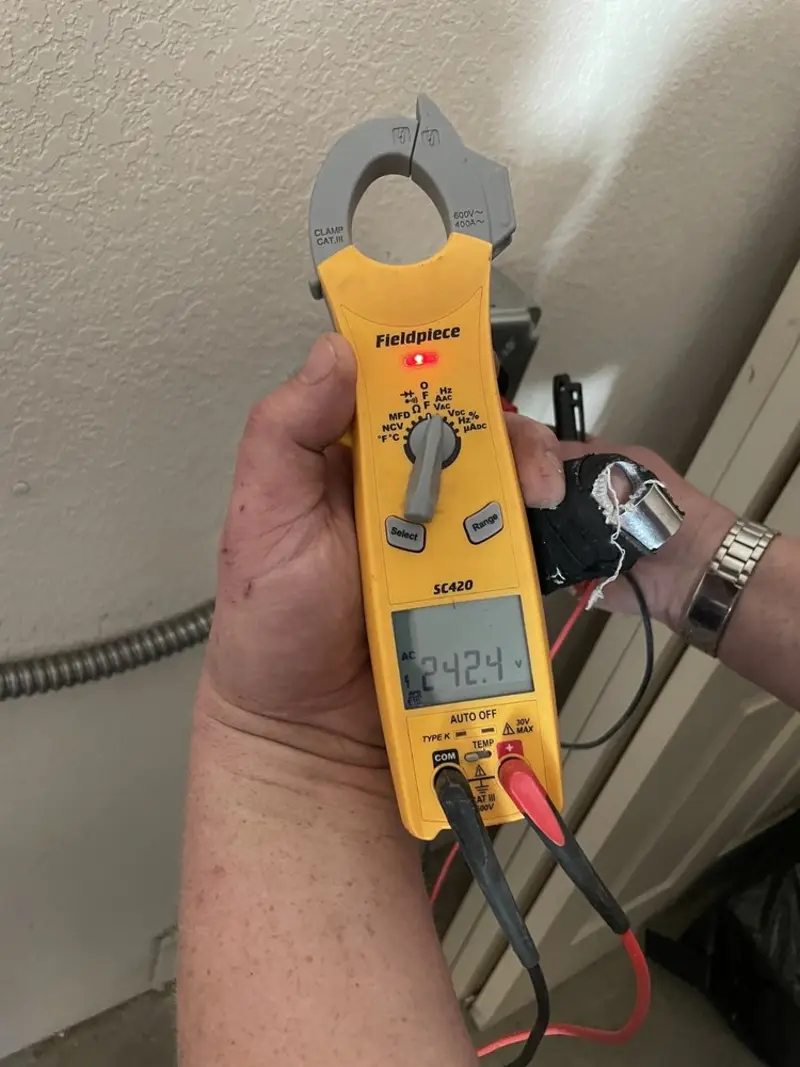 Voltage testing with clamp meter during Electrical Installation Services in Plymouth